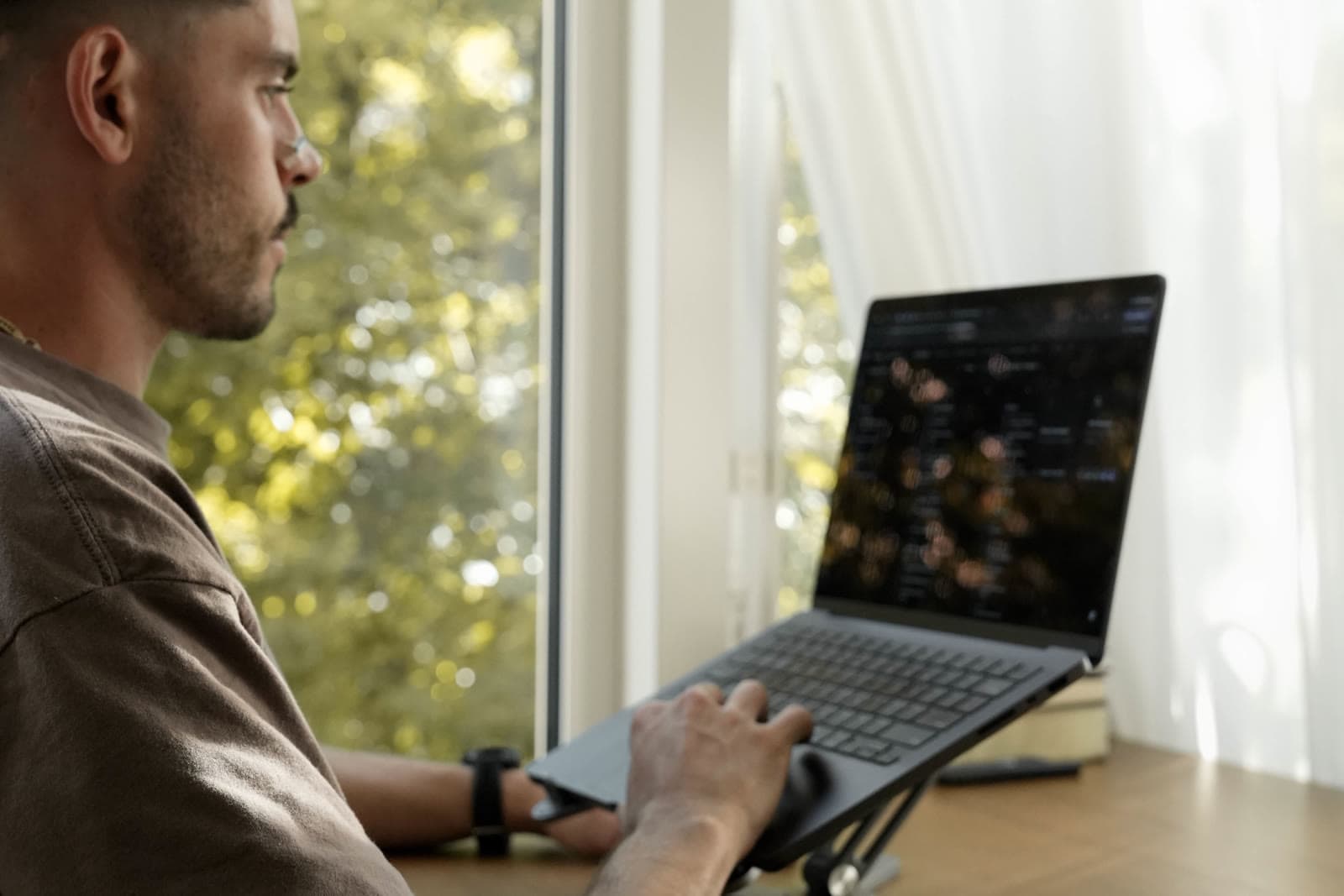 Daniel Day programming on his laptop